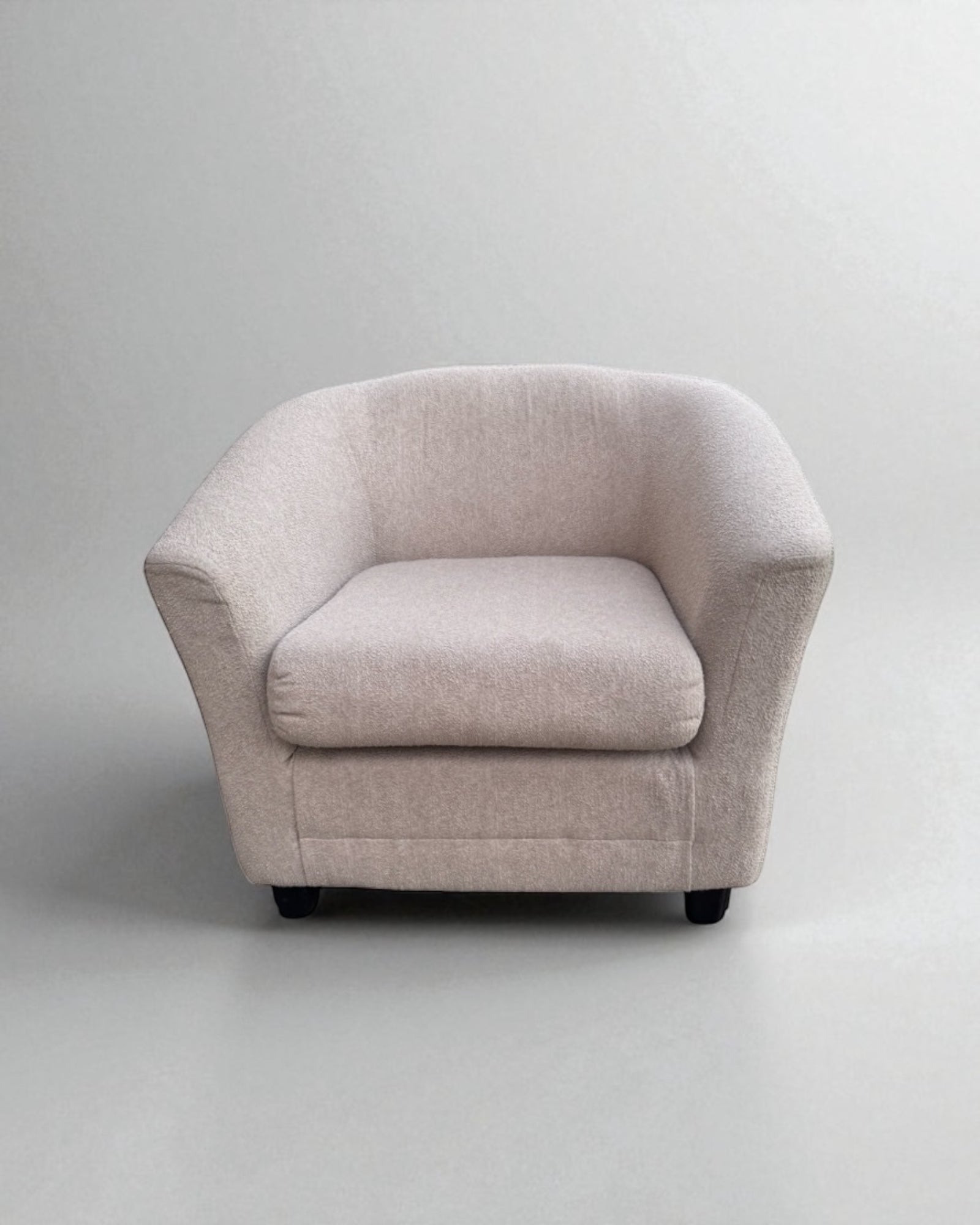 Beige Modern Barrel Accent Chair on a light gray background